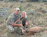 Me and my wife on a 2006 deer hunt.  He's not all the big but he was an archery buck and the first hunt I was able to take my wife on so it ranks...